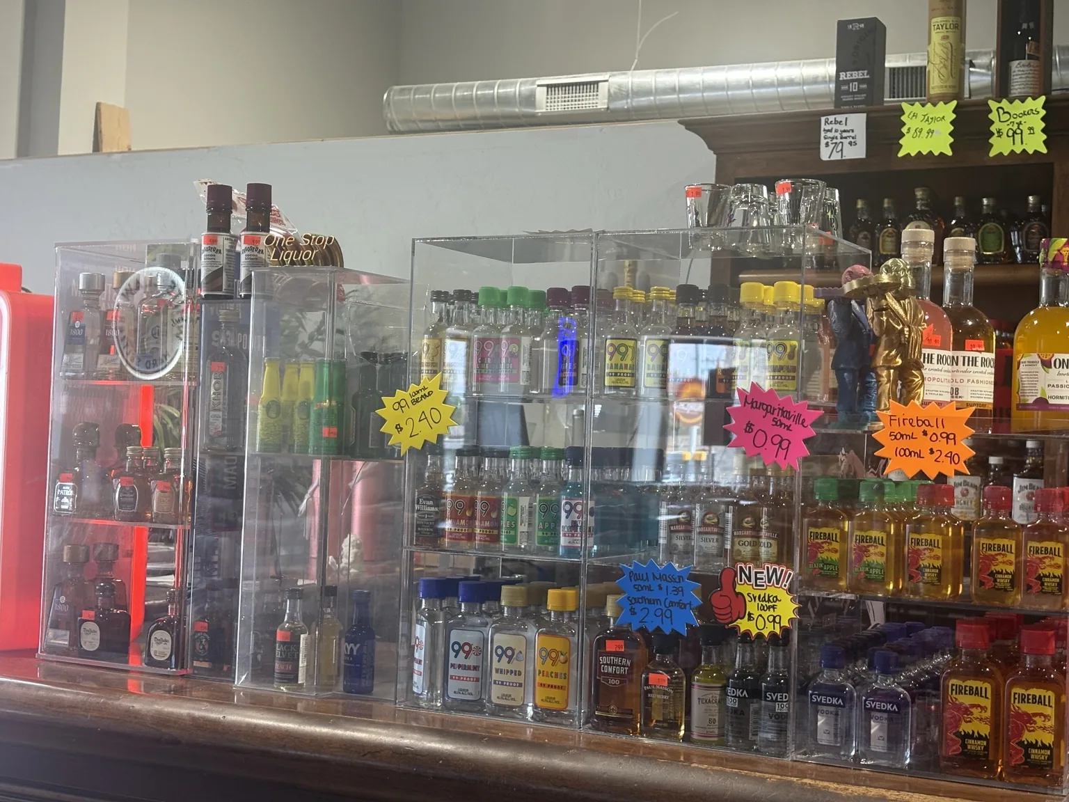 Miniature bottles, bitters and bottled cocktails in the One Stop Liquor counter display