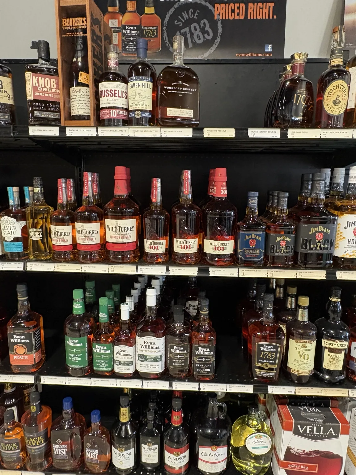 Knob Creek and other bourbon bottles above Wild Turkey and assorted whiskeys at One Stop Liquor in Bethany, Oklahoma