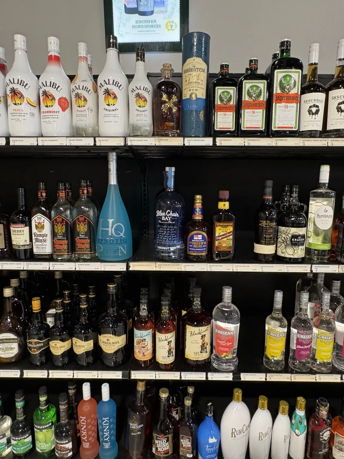 Malibu and Jägermeister bottles with assorted liqueurs and cordials at One Stop Liquor in Bethany, Oklahoma
