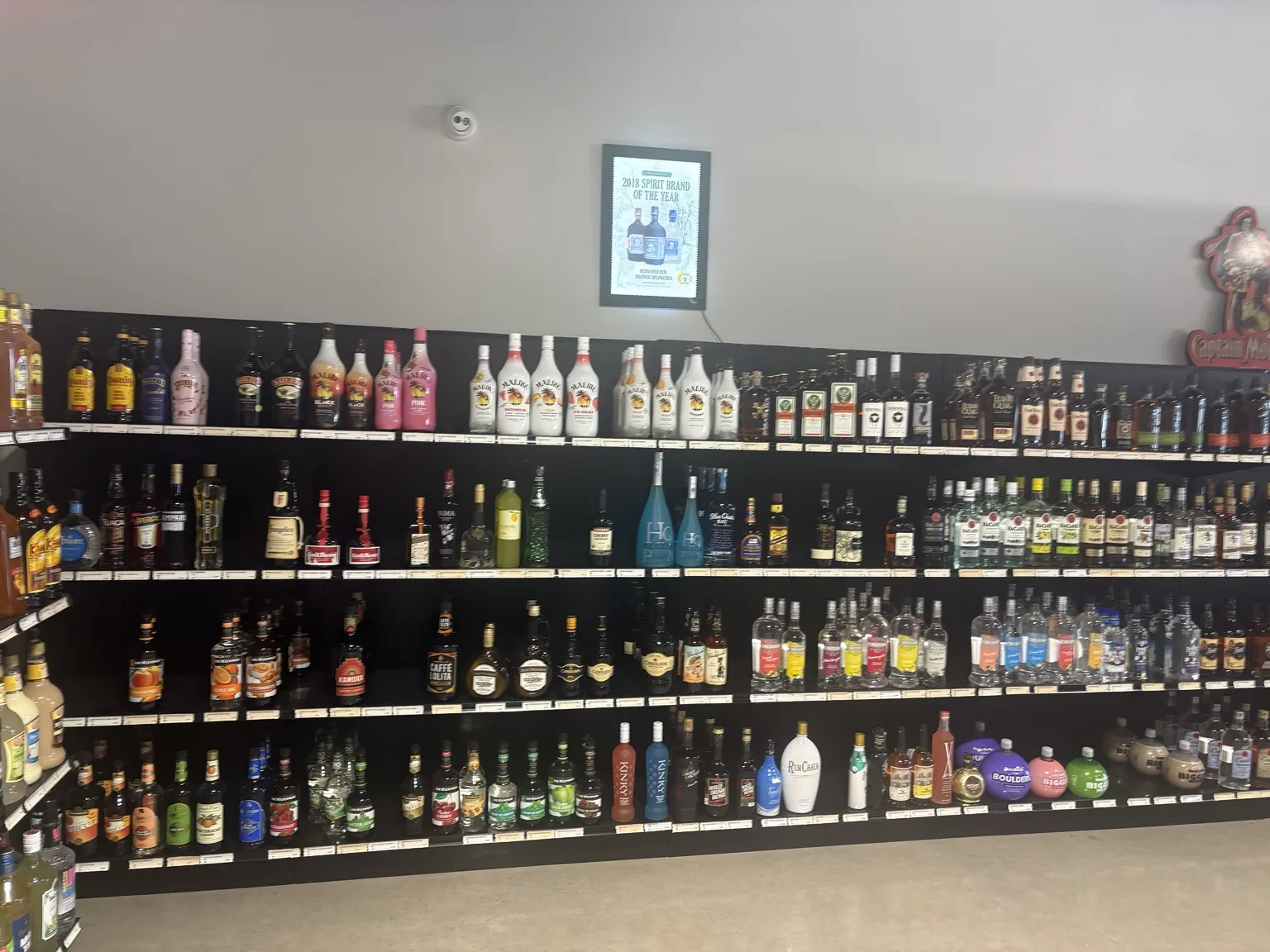 Rum and liqueur selection including Malibu, Bacardí, Baileys and cocktail ingredients