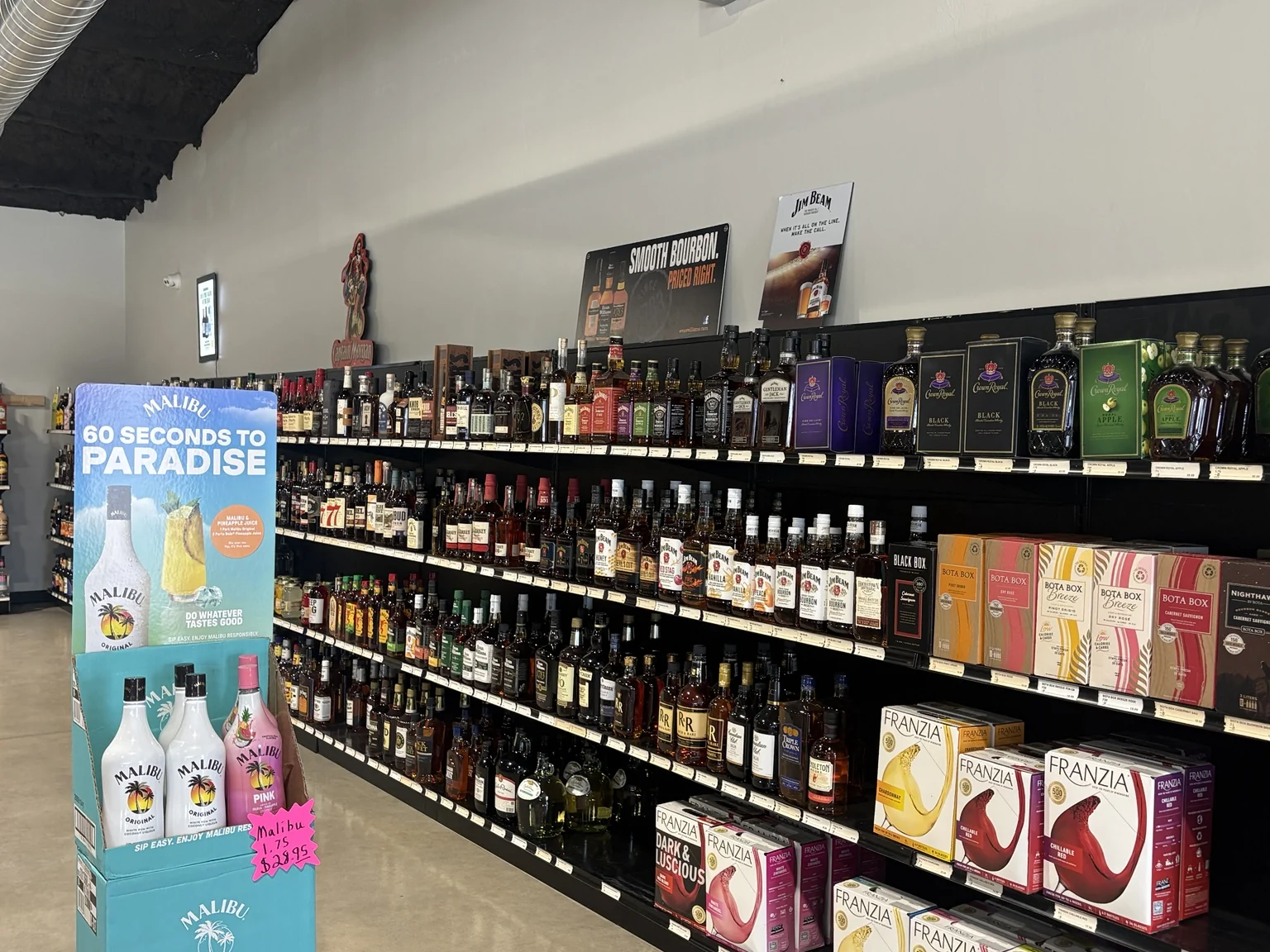 The spirits shelves at One Stop Liquor