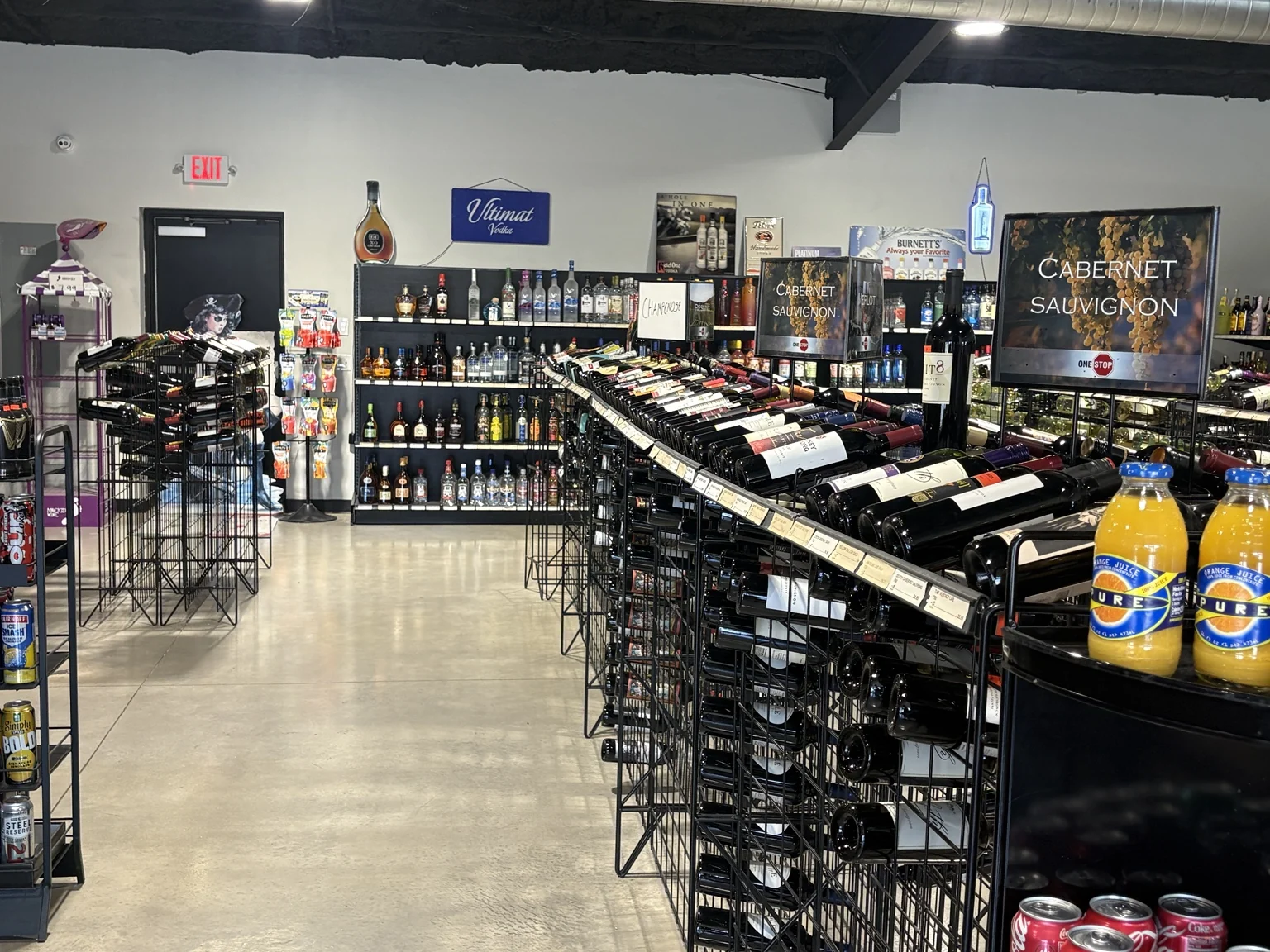 Rows of wine bottles in the store's wine racks